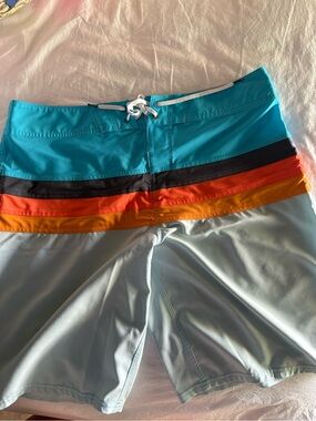 Billabong Turquoise Board Shorts with Black, Orange and Yellow Stripes